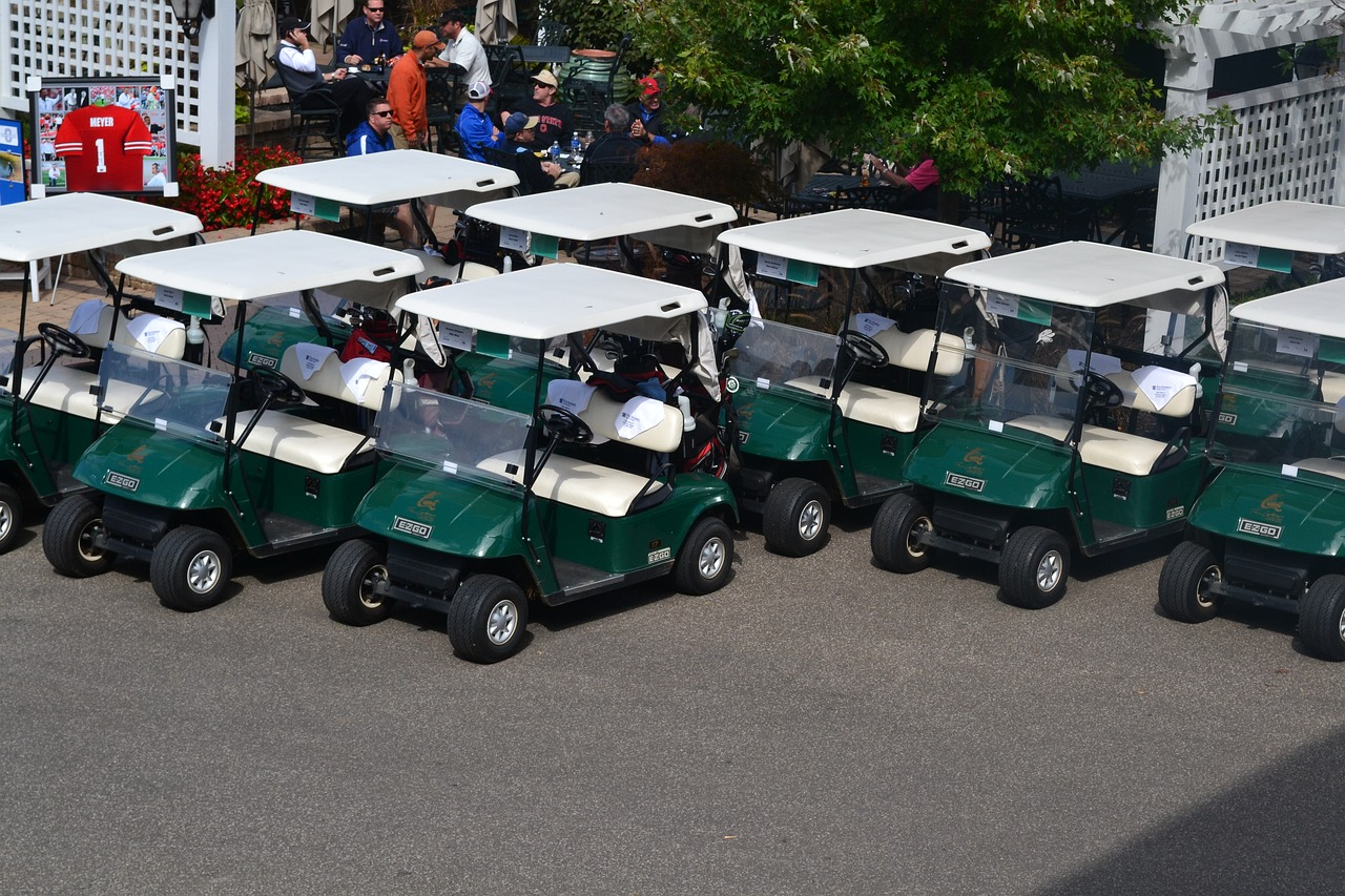 E-Z-GO golf carts in a parking lot