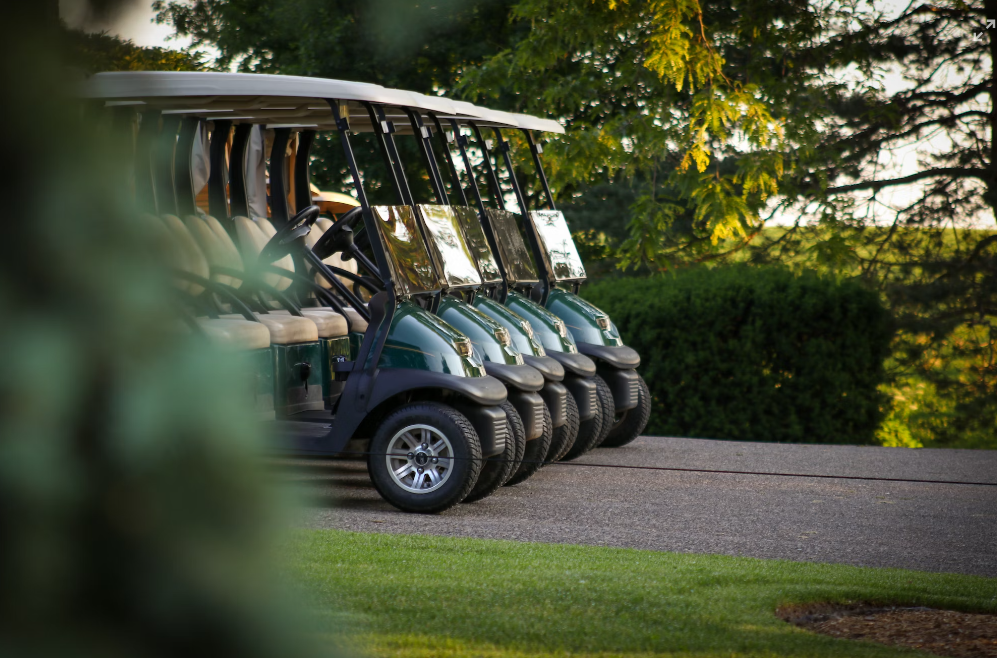 Four golf carts for sale.