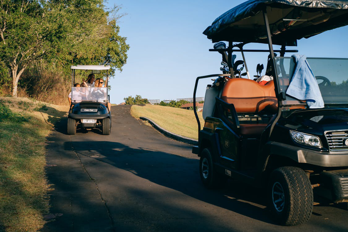Two golf carts on the course
